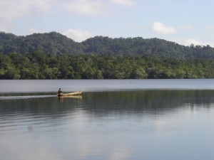 Mayan paddling cayuco near Rio Dulce