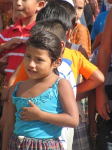 Mayan Q'eqchi' girl pledging allegiance to the Guatemalan flag