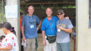 Members of St Francis Medical Mission team take a break during a long hot day of attending to villagers alon the Rio Dulce