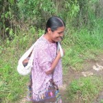 Mayan Q'eqchi woman carrying small baby