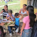 Maya Q'eqchi family enjoying lunch at grand opening