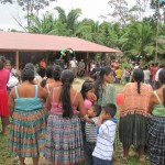 Mayan Q'eqchi family watching grand opening dedication