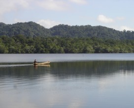 Mayan paddling cayuco near Rio Dulce