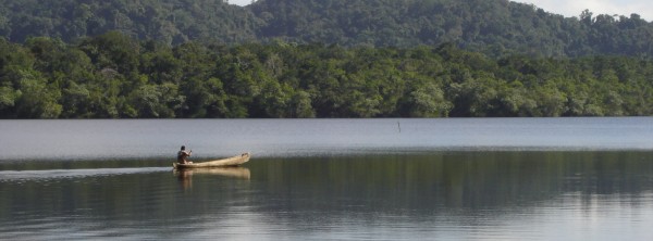 Mayan paddling cayuco near Rio Dulce