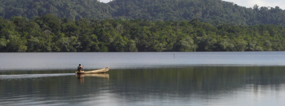 Mayan paddling cayuco near Rio Dulce